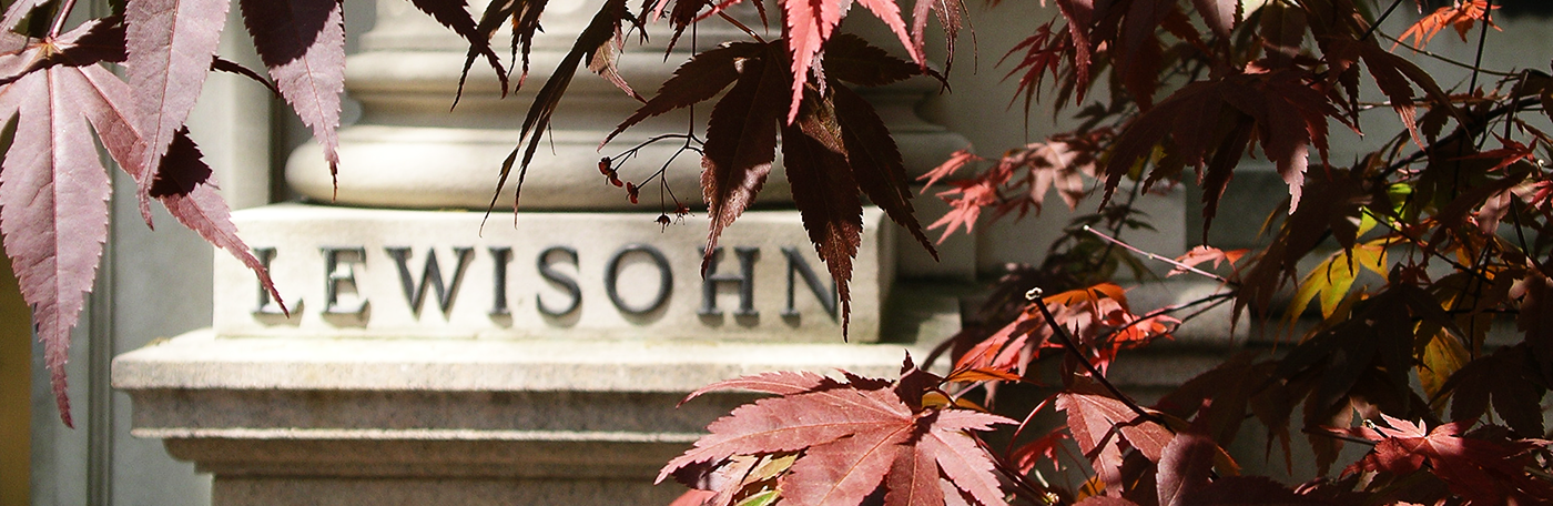 Close-up shot of Lewisohn Hall, surrounded by red leaves