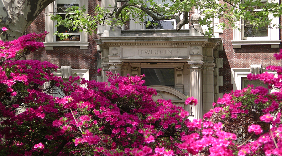 Lewisohn Hall facade at Columbia University framed by flowers.