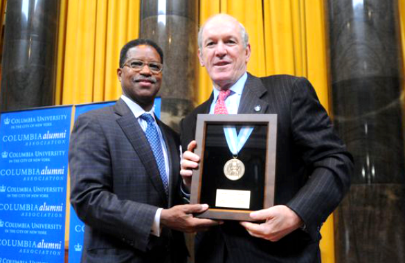GS alumnus Larry Lawrence displays the University Medal for Excellence, which he was awarded in 2010