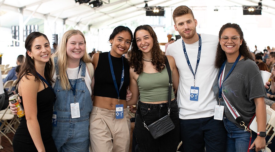 Students smiling at the New Student Welcome during Orientation