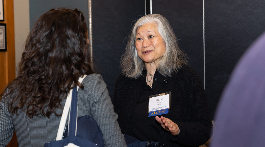 Two Individuals Talking at Alumni Office Hours