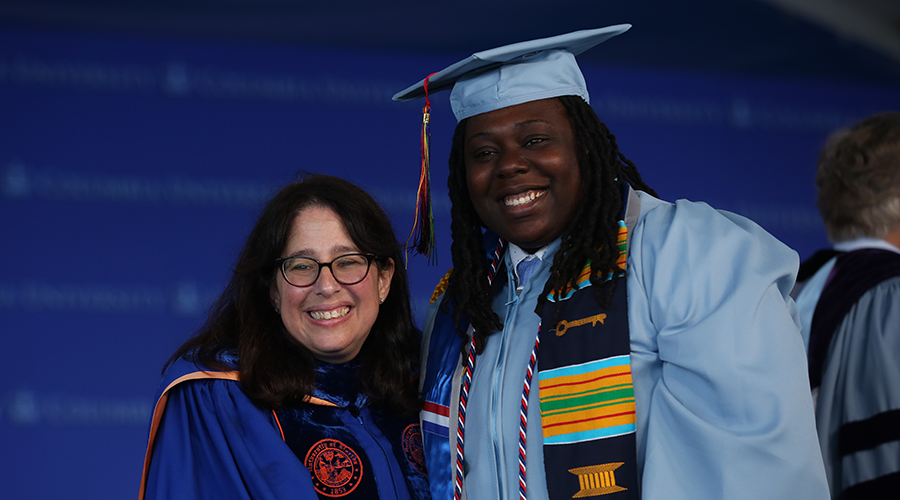 Dean Lisa Rosen-Metsch shakes the hand of 2019 GS graduate Donita Session at Class Day