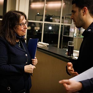 Dean Rosen-Metsch presenting a student with their Honor Society Certificate