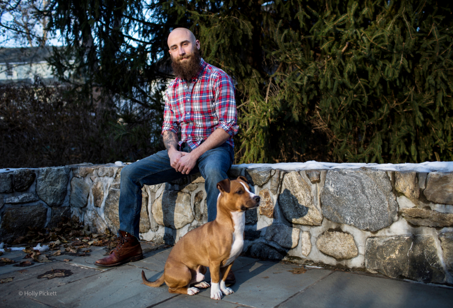 Kristofer Goldsmith '20 and his dog, Frosting (Photo: Holly Pickett) Kristofer Goldsmith sitting next to his dog