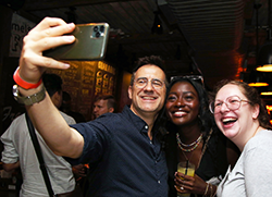 Alumni pose for a selfie at the Welcome Reception Hosted by the GS Alumni Association (GSAA) Three attendees pose for a selfie at the GSAA Welcome Reception