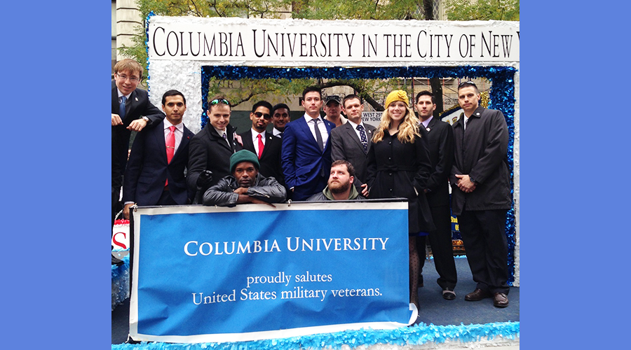Students and alumni stand on the Columbia GS float at the 2013 NYC Veterans Day Parade