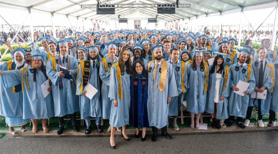 Group photo of the Class of 2023 with Dean Lisa Rosen-Metsch '90GS at the 2023 Class Day Ceremony