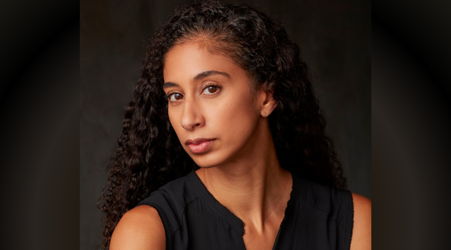 Alicia Graf Mack '03GS in front of a dark background