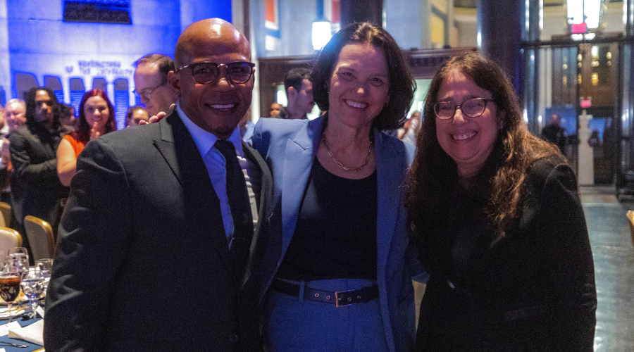Dominic Dupont '26GS, Columbia University Interim President Katrina Armstrong, and Columbia GS Dean Rosen-Metsch '90GS pose for a photo in Low Library during the annual GS Scholarship Celebration.