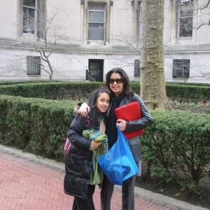 Evelin Collado '10GS with daughter