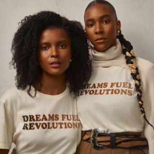 Justice and Nia Betty in "Dreams Fuel Revolutions" shirts