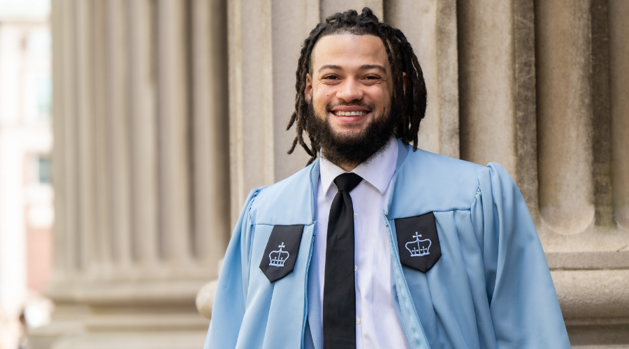 Portrait of Columbia GS graduate James Harvey Elliott II '23GS in Columbia regalia.