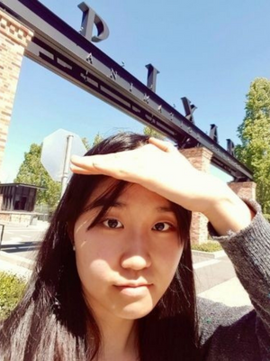 Aloicia (Chaieun) Lee ‘23PBPM standing in front of a gateway reading "Pixar"