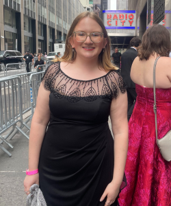Maeve Sheehan '26GS standing in front of Radio City Music Hall