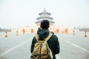 Student in front of temple.