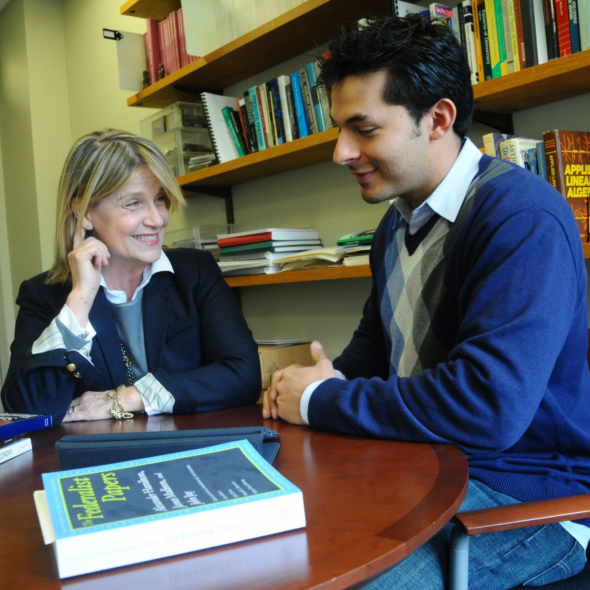 Student and advisor having a discussion.