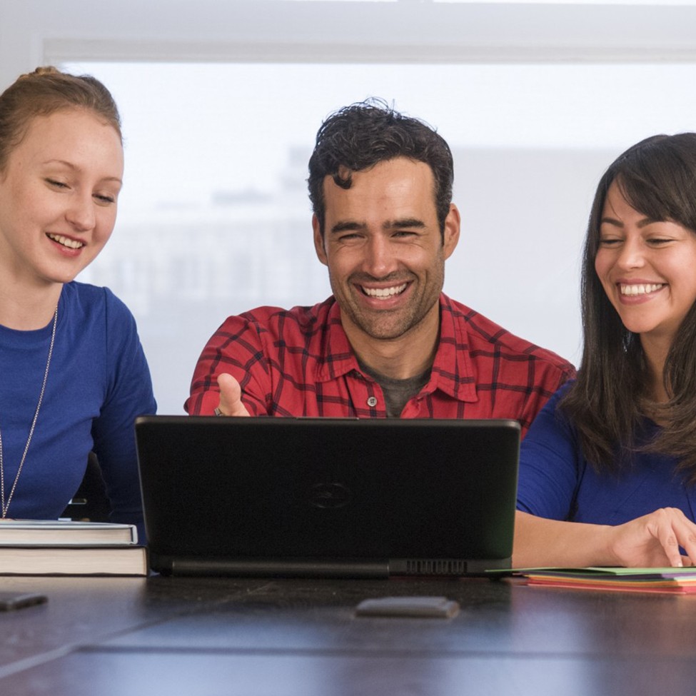 students sitting at a desk