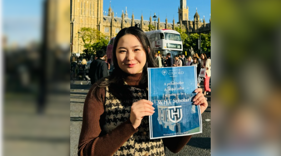 Ama Munkhbayar profile holding sign