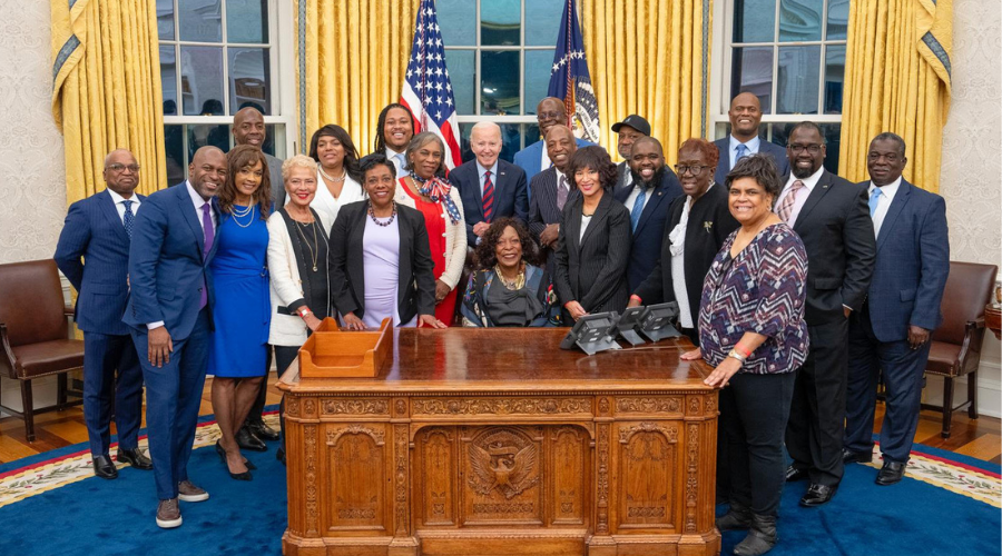 Denise Louise Pease '83GS (center, seated) with President Joe Biden and the members of the Biden administration’s Advisory Commission on Advancing Educational Equity, Excellence, and Economic Opportunity for Black Americans