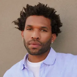 emmanuel williams headshot in blue button up