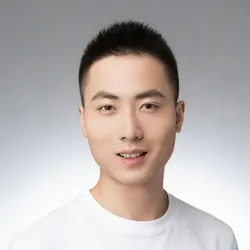 Hengbo Yang headshot with grey background and white t shirt
