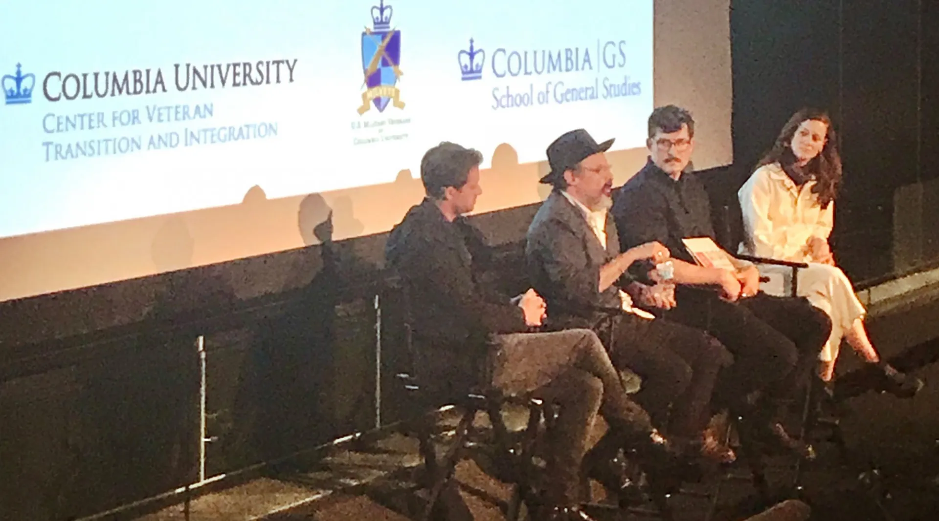 Panelists speaking after a screening of "The Report"