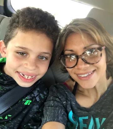 Incoming GS student Monica Victoria poses for a selfie with her son