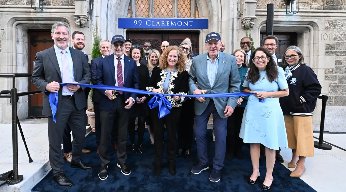 Columbia University President Jennifer L. Mnookin standing with a group of Deans, administrators, Trustees, and alumni in front of 99 Claremont, the new residential hall dedicated for Columbia GS students.