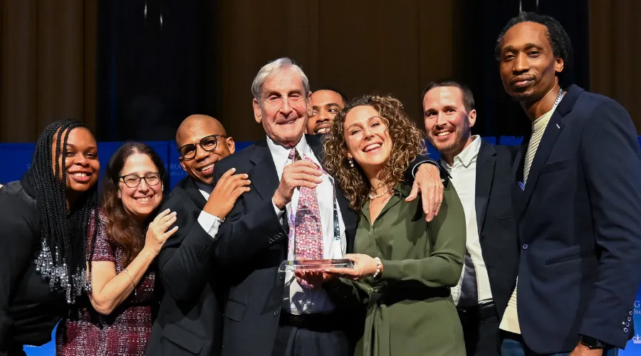 Rene Plessner '60CC (center) with Dean Lisa Rosen-Metsch '90GS and GS students and alumni who are current or former recipients of the Plessner Scholarship.