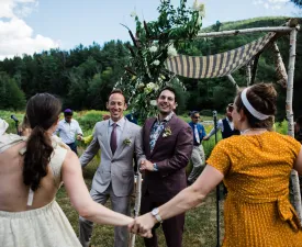 Aaron Loux ‘25GS, with his husband Harry Reis at their wedding. Photo credit Jen Brister.