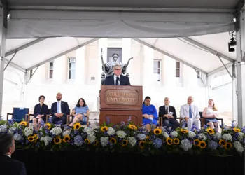 Speakers on stage during convocation.