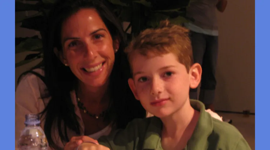 A woman and her son pose for a picture at the US Open