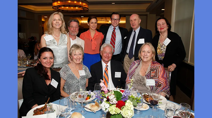 Reunion dinner attendees pose for a photo