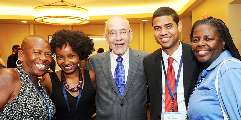 Dean Awn poses with four GS alumni