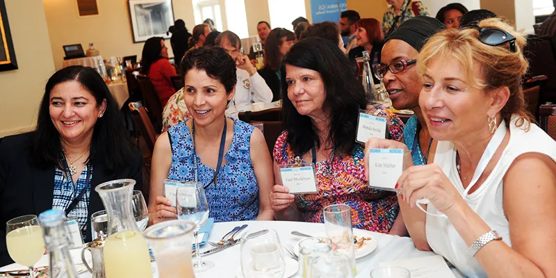Five alumnae enjoy dessert at the Dean's Luncheon