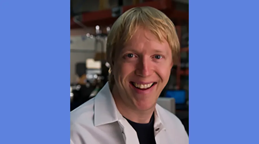 Headshot of Ben Robison in a lab coat