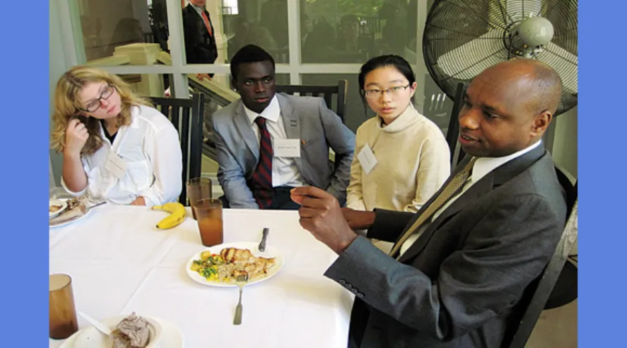 Deo Niyizonkiza, the subject of a Pulitzer Prize-winning book, 'Strength in What Remains'  talks to Berkshire School students 