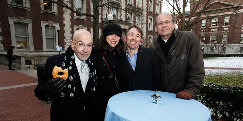 Group of attendees pose outside Lewisohn Hall