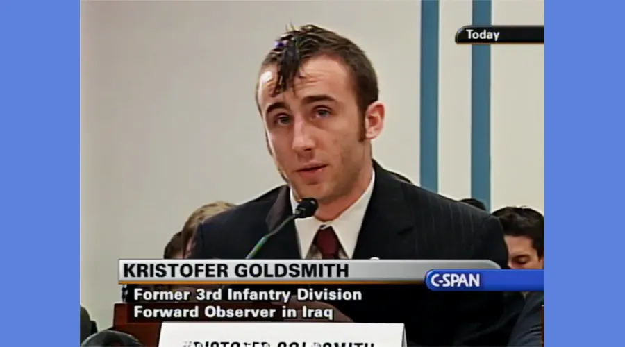 Photo still from C-SPAN of Kristofer Goldsmith addressing Congress