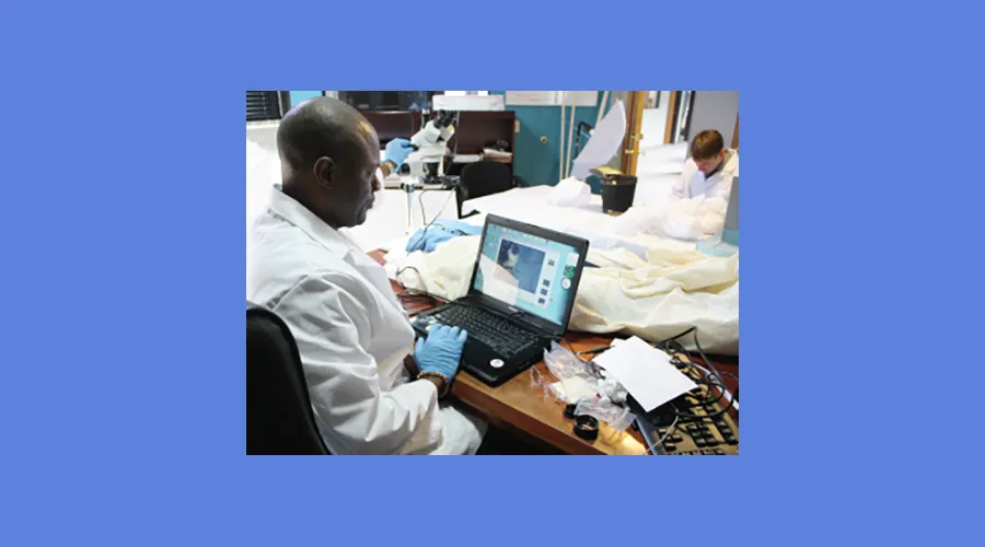 Michael Taylor working on a laptop in a lab
