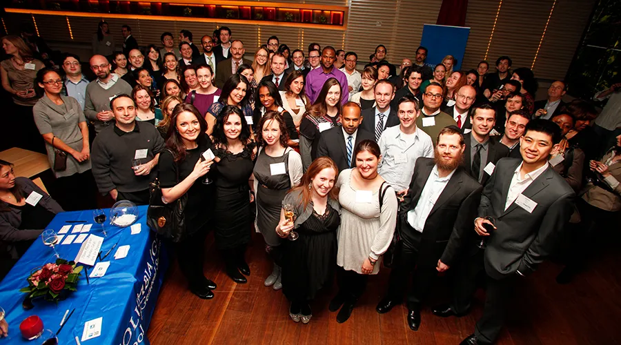 Attendees pose for a group shot taken from above