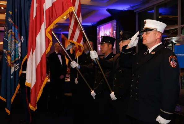 Officers hold flags
