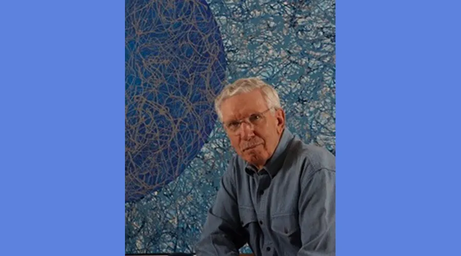 Headshot of Edward Pease in front of one of his paintings