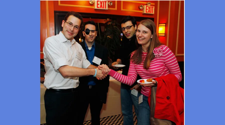 Students with the class of 2011 pose for a photo at the Recent Alumni Leadership Committee