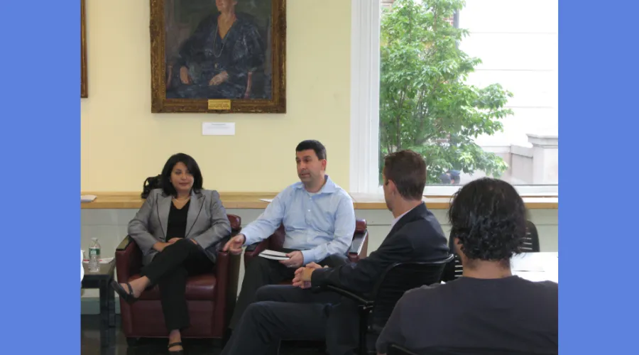 New students and alumni gather in the lounge