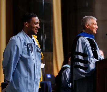 Speaker Paul Izard smiles as Dean Colgrove introduces him.
