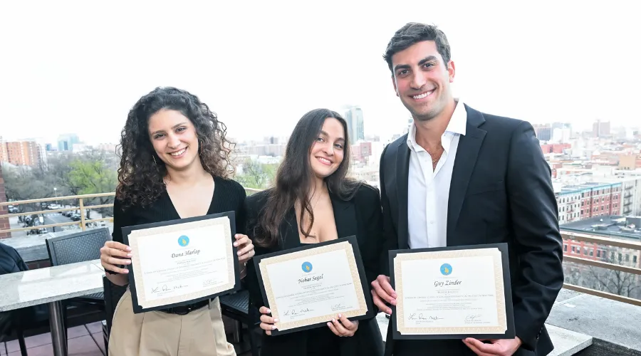Three GS Honor Society inductees posing with their certificates.