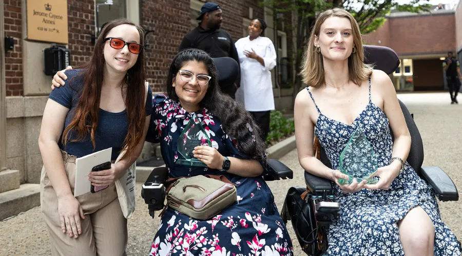 Three attendees of the 2024 Student Leadership Awards outside of the ceremony venue