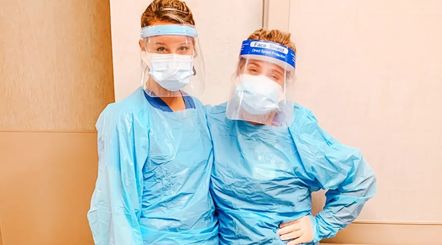 Postbac Premed student Karianne Weber and a co-worker
