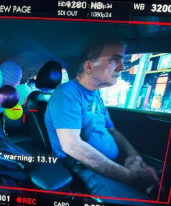 Photo of a video screen capturing a NYC taxi driver